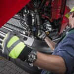 Close-Up Of Man Working In Garage