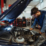 Car mechanic fixing the car in car repair shop