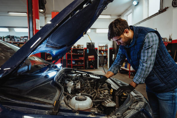 Car mechanic fixing the car in car repair shop