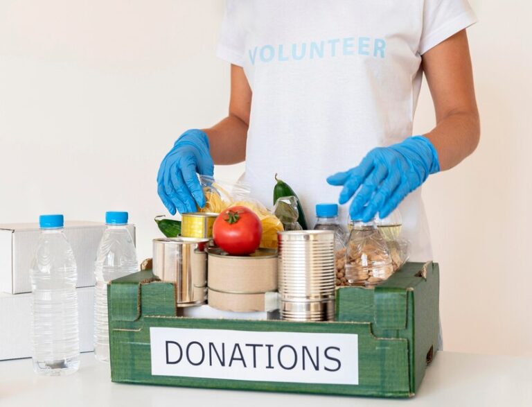 volunteer-with-gloves-handling-box-food-donations_23-2148733759