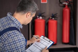professional-checking-fire-extinguisher_1016675-4027