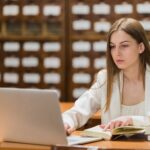 back-school-concept-with-woman-studying-library (1)