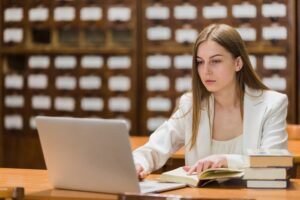 back-school-concept-with-woman-studying-library (1)