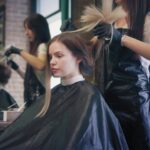 Modern beauty salon staff wearing elegant customized uniforms designed by a custom uniform supplier in Dubai