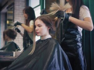 Modern beauty salon staff wearing elegant customized uniforms designed by a custom uniform supplier in Dubai