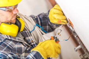 electrician-working-on-wiring-installation-in-a-residential-setting-during-daylight-hours