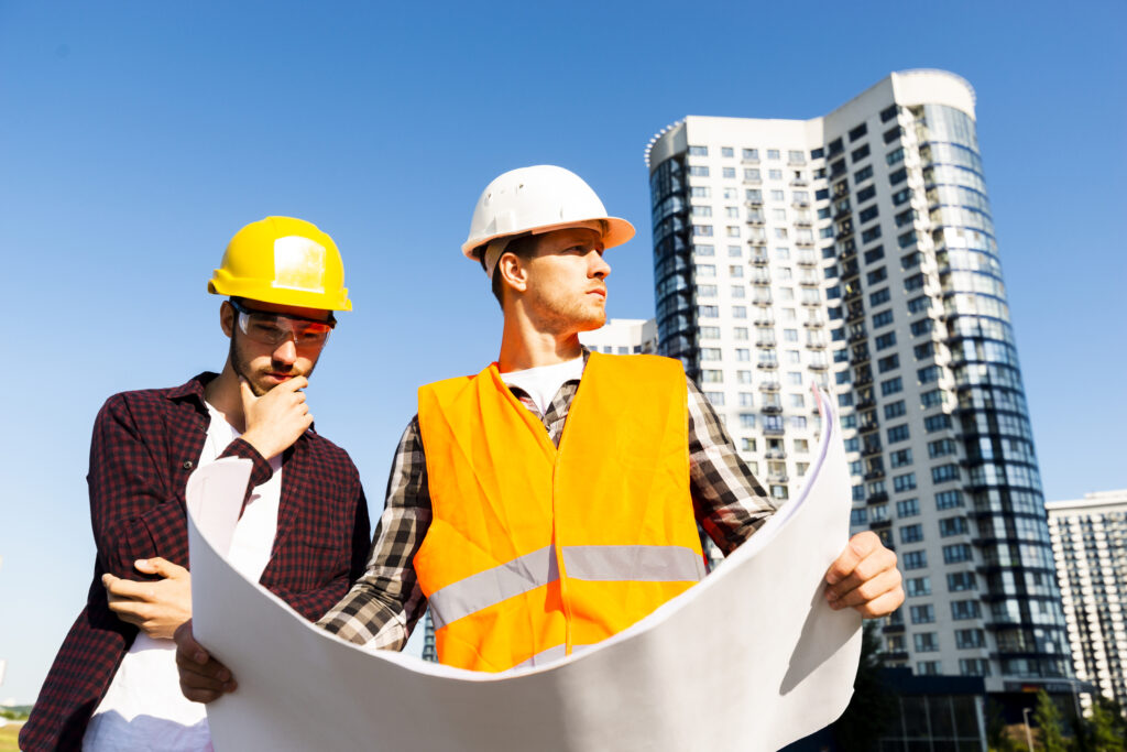 medium-shot-low-angle-view-engineer-architect-looking-plans