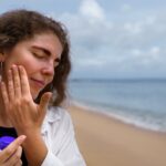 portrait-adult-woman-applying-lotion-sunburn-skin (1)