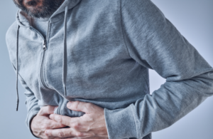 men showing Constipation in stomach