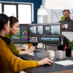 Video editor and sound engineer working togenther at project