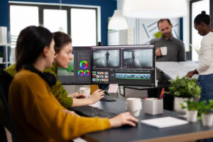 Video editor and sound engineer working togenther at project
