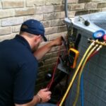 Professional air conditioning installation in Mississauga Ontario, Canada by an HVAC technician installing a high-efficiency central AC system