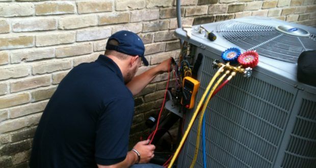 Professional air conditioning installation in Mississauga Ontario, Canada by an HVAC technician installing a high-efficiency central AC system