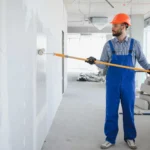 painter-in-uniform-paints-the-wall-2023-11-27-05-32-12-utc-1920x1278.jpg