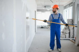 painter-in-uniform-paints-the-wall-2023-11-27-05-32-12-utc-1920x1278.jpg
