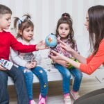 children-learning-globe-with-woman-bedroom (1) (1)