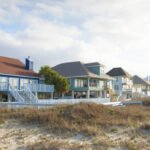 A row of vacation cottages in the sand dunes, Florida, USA.