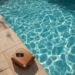 lucid-origin_A_beautiful_empty_villa_swimming_pool_glistening_under_sunlight_with_a_small_sui-0