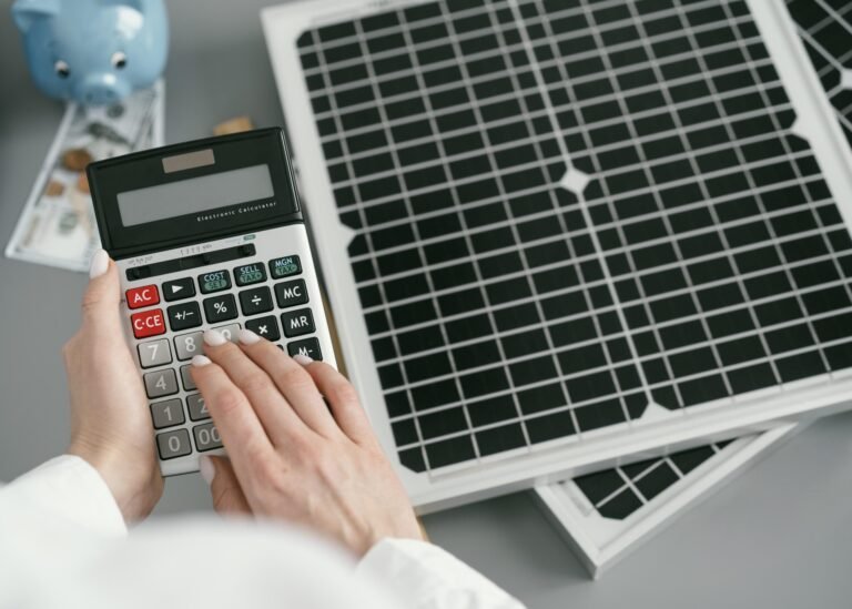 close-up-hand-typing-calculator-scaled