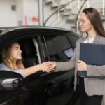imageye___-_imgi_29_woman-shaking-hands-with-car-dealer